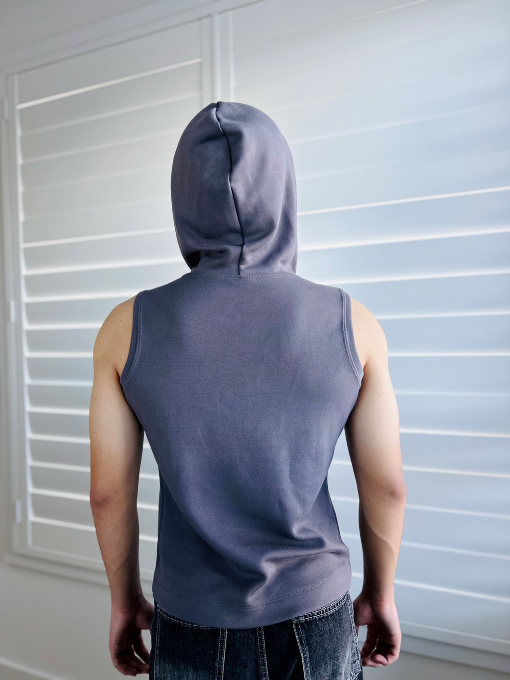 BIKINMOR Core Sleeveless Hoodie in Stone Grey back view with hood up