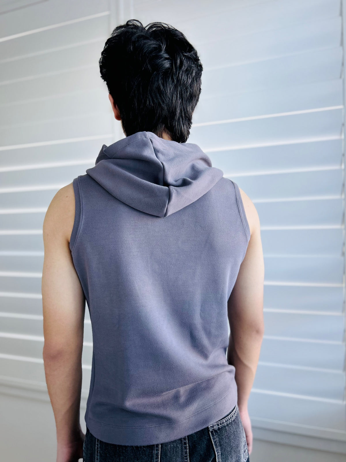 BIKINMOR Core Sleeveless Hoodie in Stone Grey back view with hood down