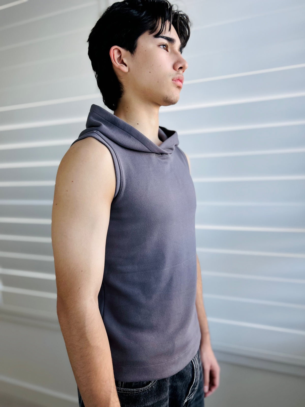 BIKINMOR Core Sleeveless Hoodie in Stone Grey close front three quarter view