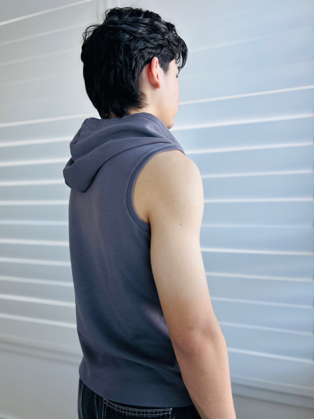 BIKINMOR Core Sleeveless Hoodie in Stone Grey rear three quarter view