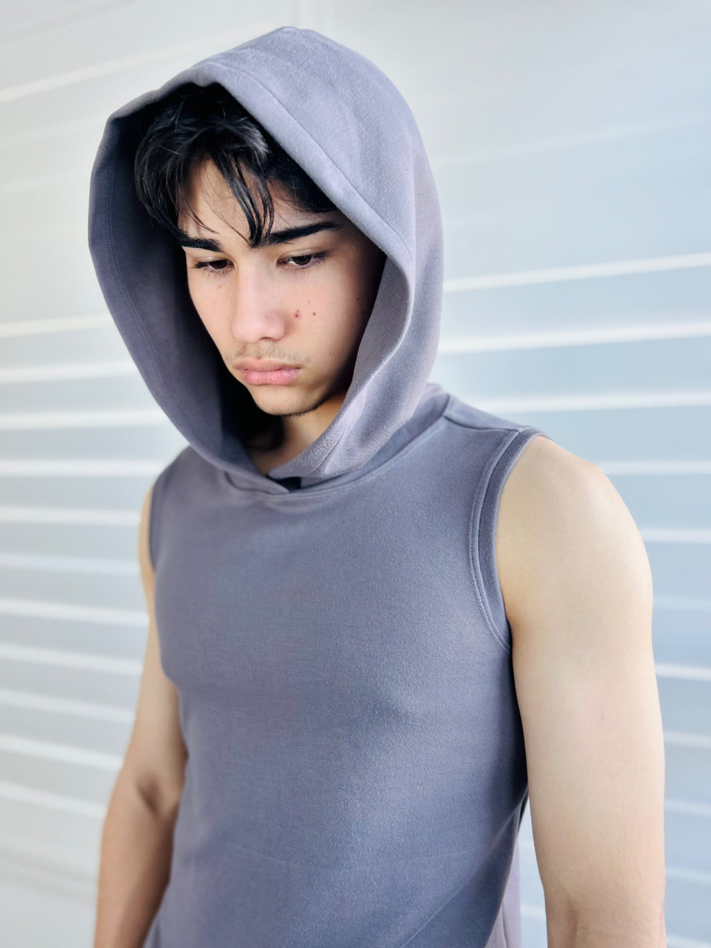 BIKINMOR Core Sleeveless Hoodie in Stone Grey close view with hood up