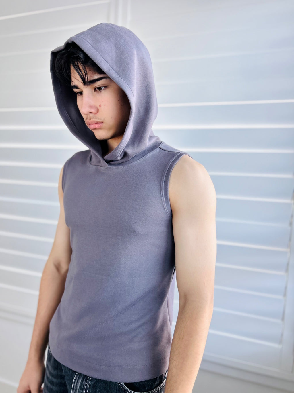 BIKINMOR Core Sleeveless Hoodie in Stone Grey three quarter view with hood up