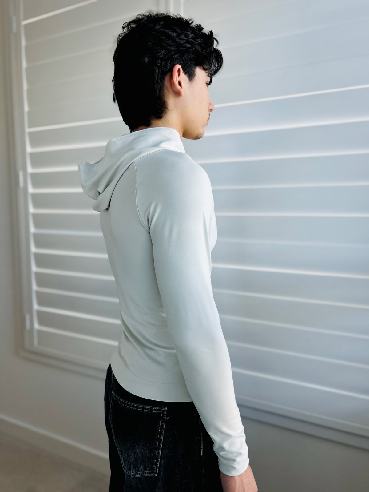 BIKINMOR Raglan Long Sleeve Hoodie in Recycled Reactivate Ivory — back three-quarter view