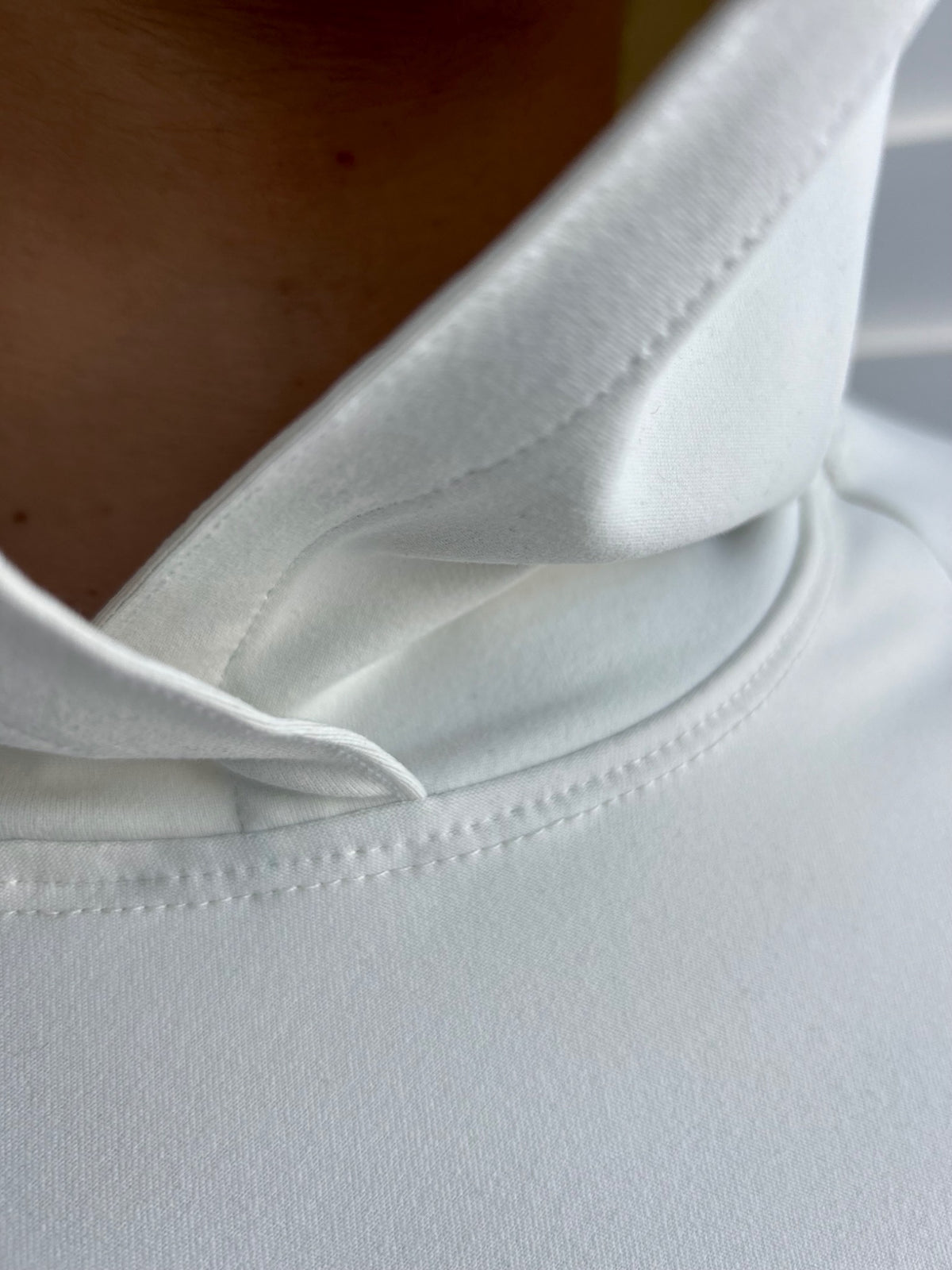 BIKINMOR Raglan Long Sleeve Hoodie in Recycled Reactivate Ivory — neckline construction detail