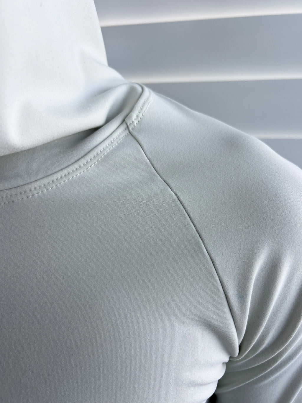 BIKINMOR Raglan Long Sleeve Hoodie in Recycled Reactivate Ivory — raglan seam detail