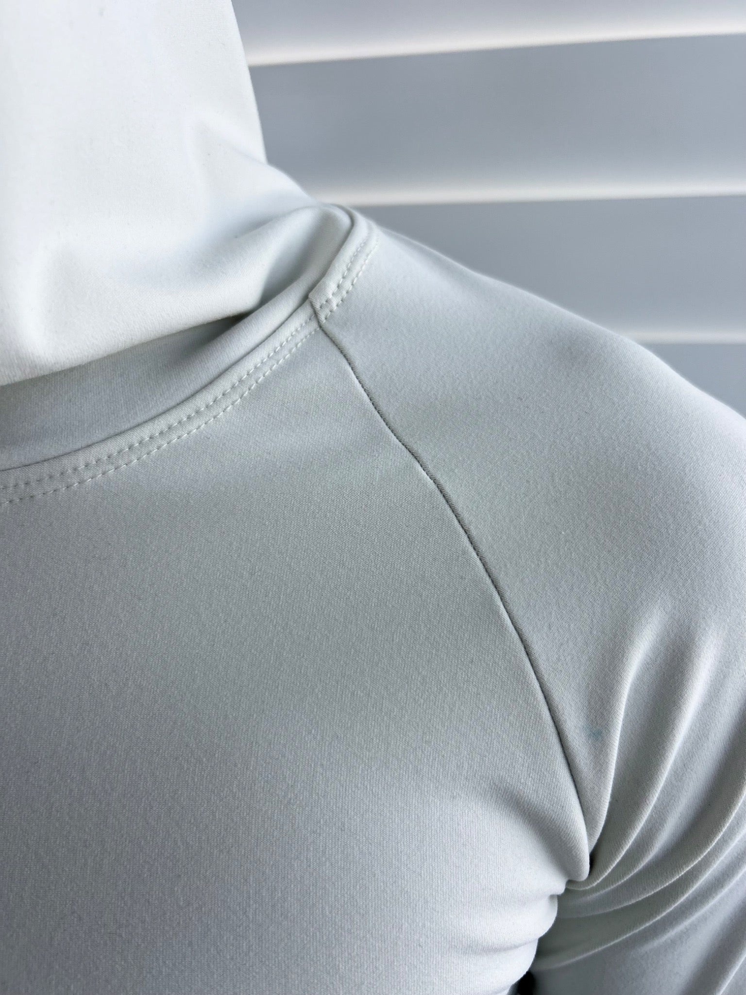 BIKINMOR Raglan Long Sleeve Hoodie in Recycled Reactivate Ivory — raglan seam detail