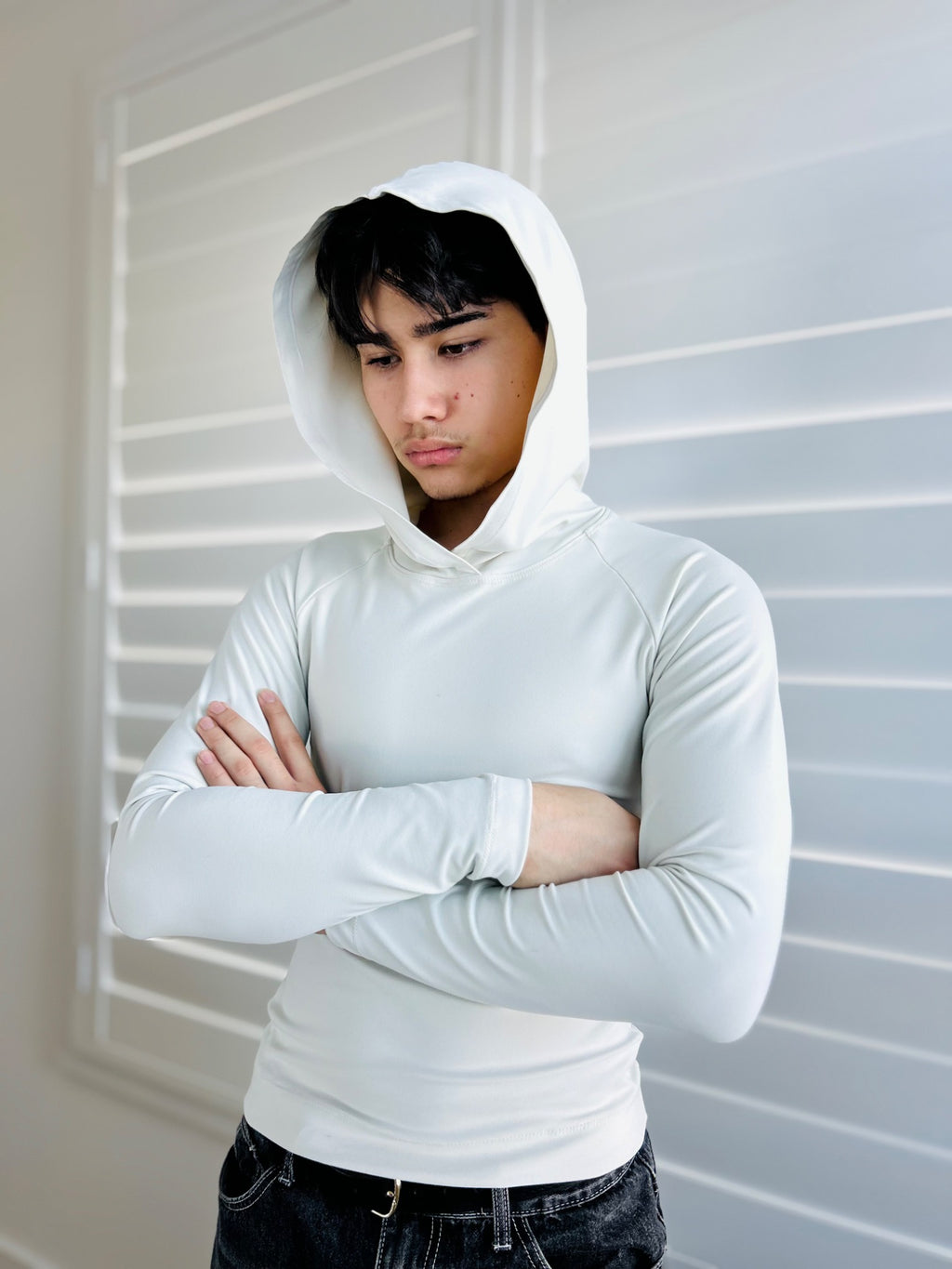 BIKINMOR Raglan Long Sleeve Hoodie in Recycled Reactivate Ivory — crossed arms view