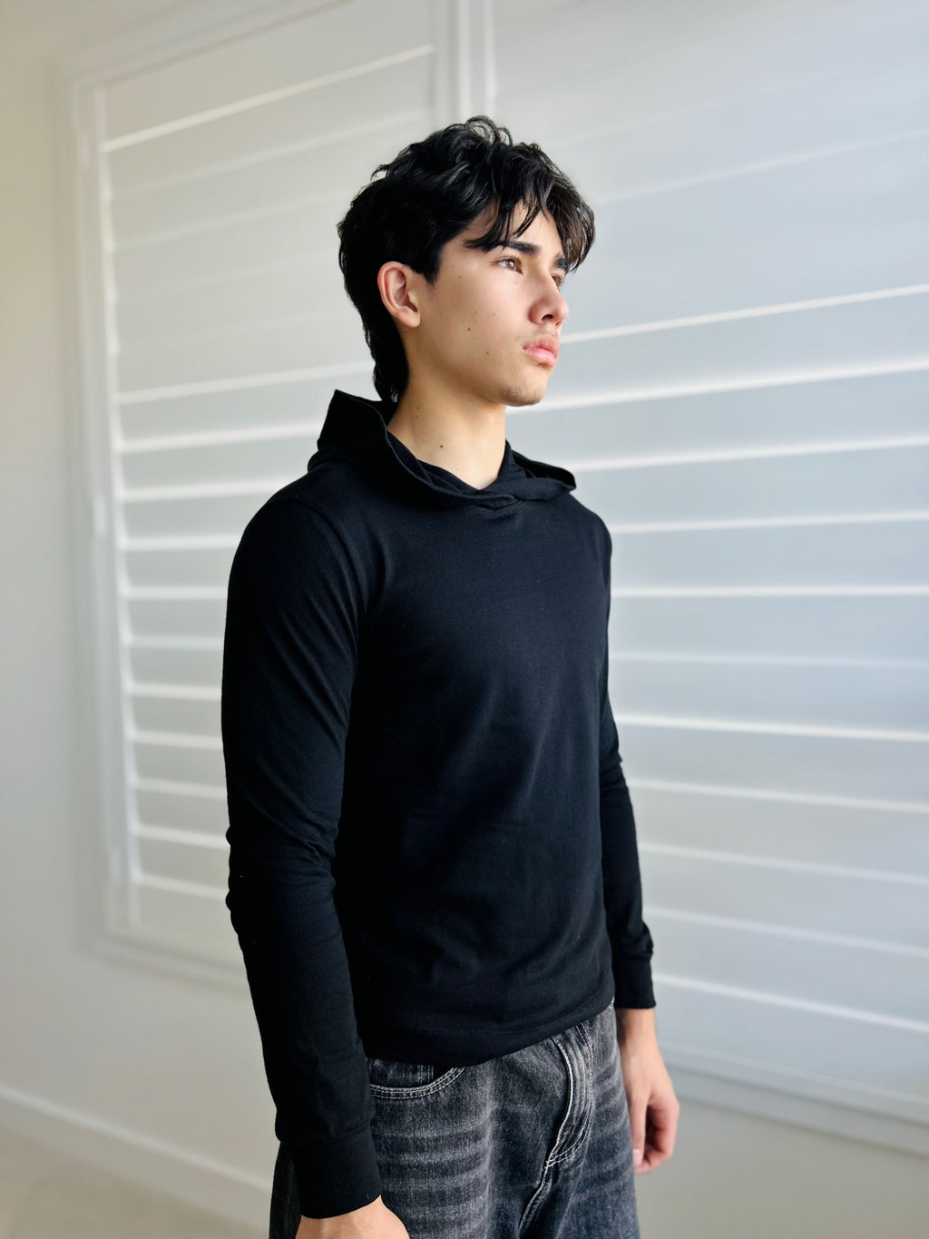 BIKINMOR Slim Fit Long Sleeve Hoodie in Santa Fe Black, size XS, three-quarter view