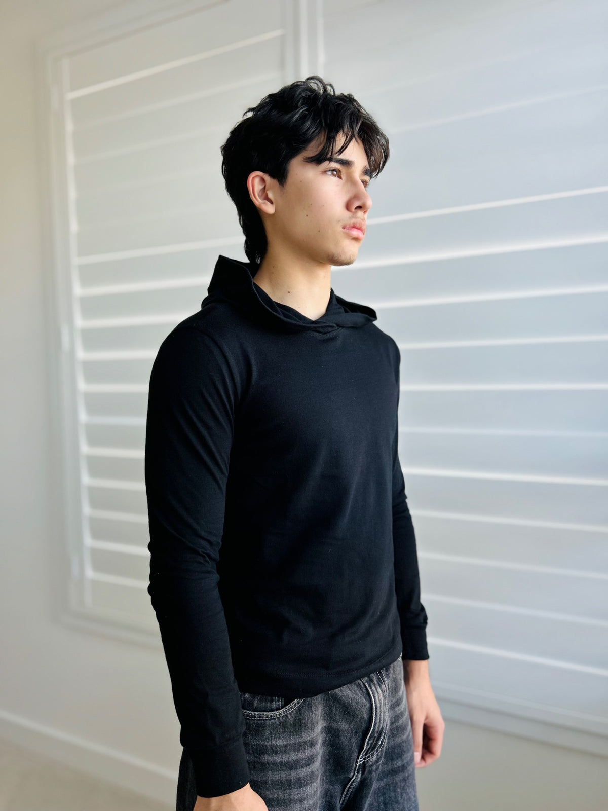 BIKINMOR Slim Fit Long Sleeve Hoodie in Santa Fe Black, size XS, three-quarter view