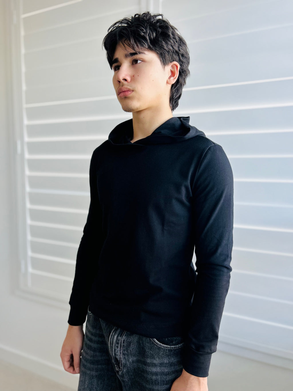 BIKINMOR Slim Fit Long Sleeve Hoodie in Santa Fe Black, size XS, three-quarter front view