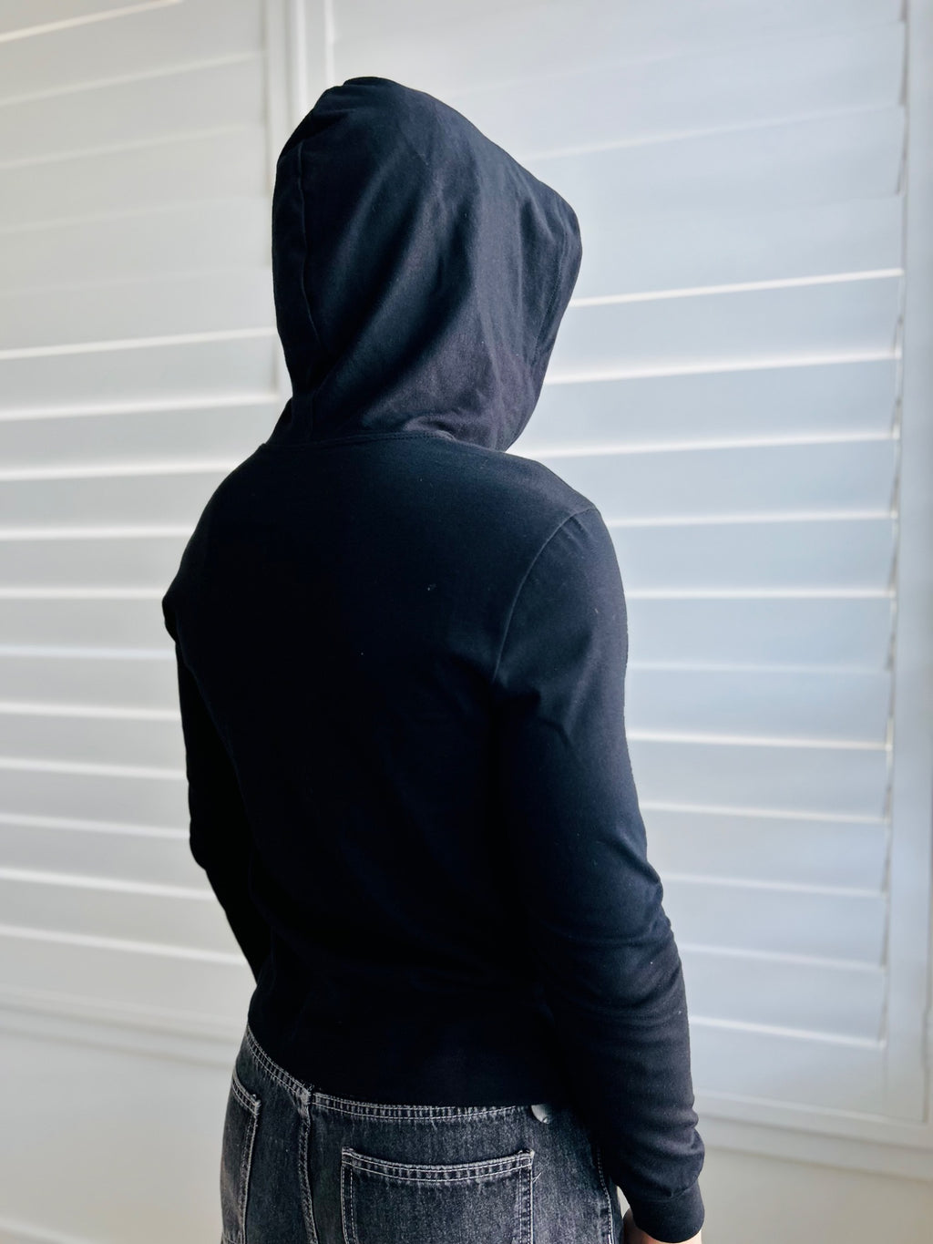 BIKINMOR Slim Fit Long Sleeve Hoodie in Santa Fe Black, size XS, hood up three-quarter back view